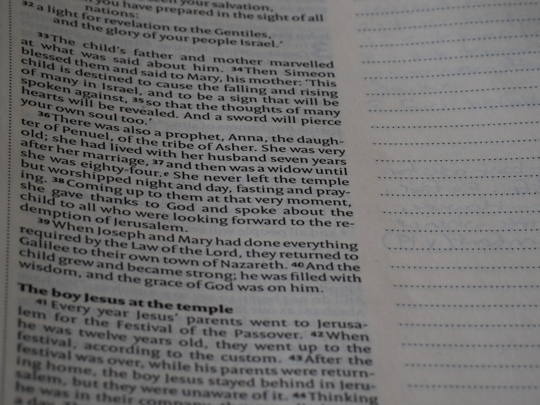 A close up of an open book with writing on it