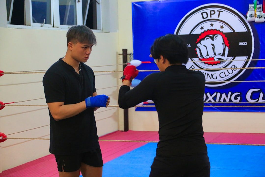 a man and a woman standing in a boxing ring